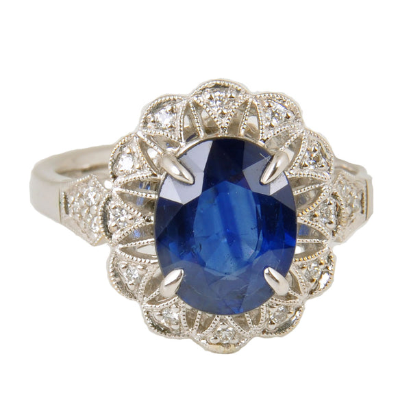 18KT White Gold Ladies Ring with Oval Cut Sapphire & Round Cut Diamonds