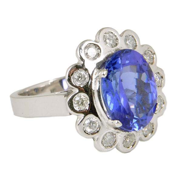 14KT White Gold Ladies Ring with Oval Cut Tanzanite & Bezel Set Round Brilliant Cut Diamonds