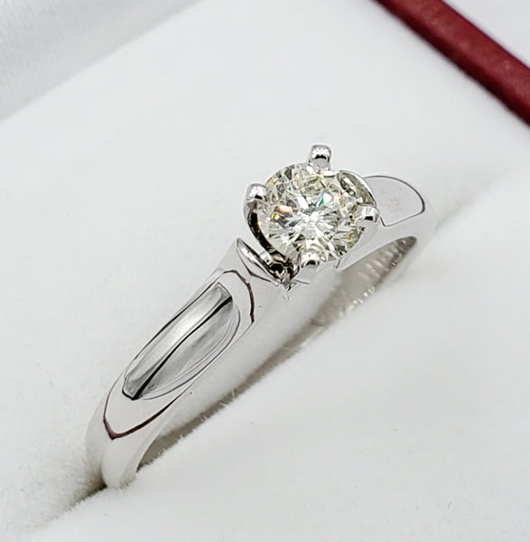 14kt white gold ring with one prong set round brilliant cut diamond 0.32ct