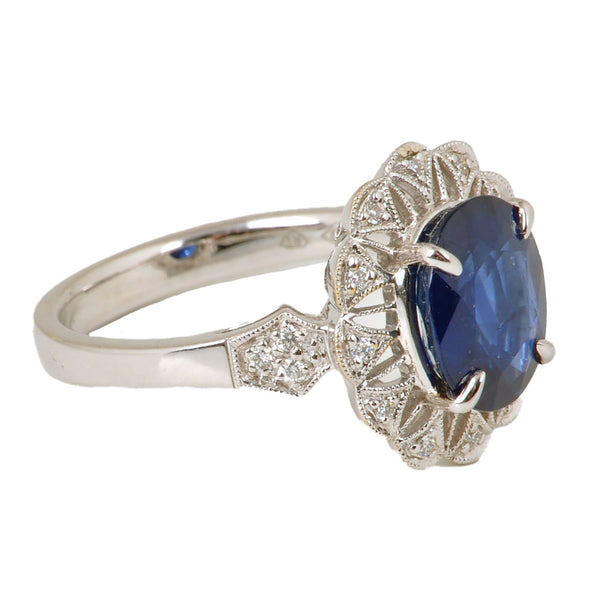 18KT White Gold Ladies Ring with Oval Cut Sapphire & Round Cut Diamonds