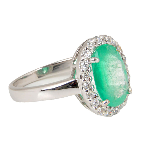 18KT White Gold Ladies Ring with Prong Set Oval Cut Emerald & Round Cut Diamonds