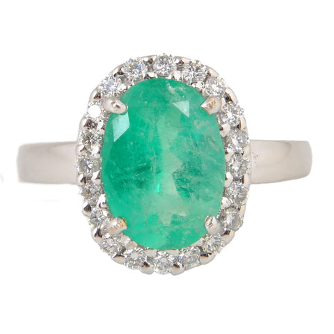 18KT White Gold Ladies Ring with Prong Set Oval Cut Emerald & Round Cut Diamonds