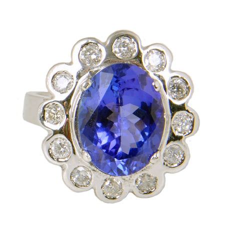 14KT White Gold Ladies Ring with Oval Cut Tanzanite & Bezel Set Round Brilliant Cut Diamonds